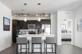 Beautiful kitchen design featuring quartz countertops, and two cabinet color options to select from